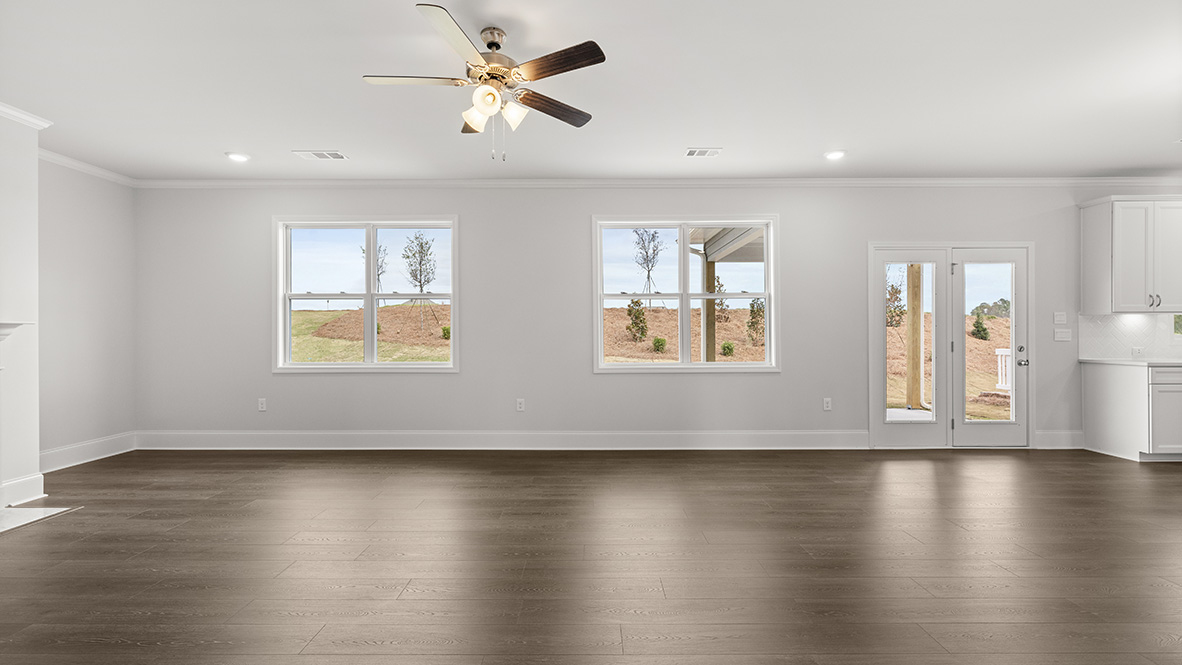 Interior living area with fire place and large windows