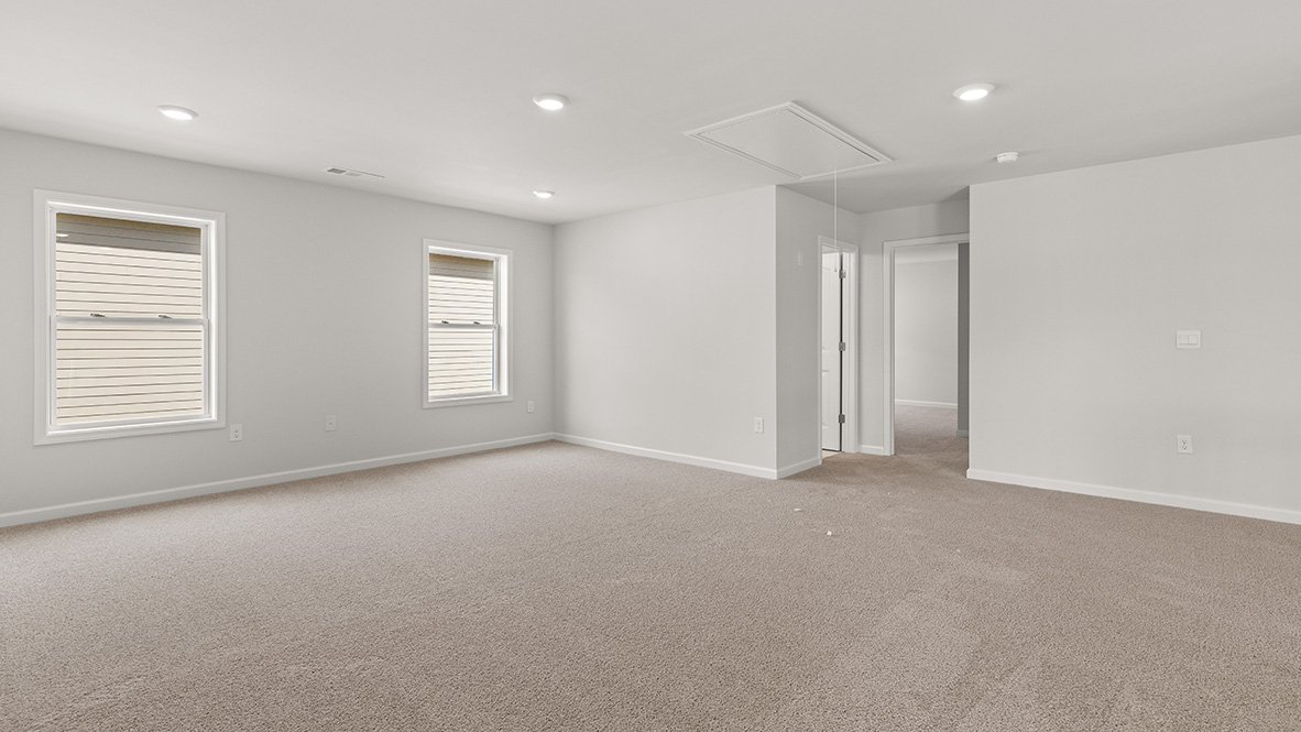 Interior upstairs loft area open to staircase