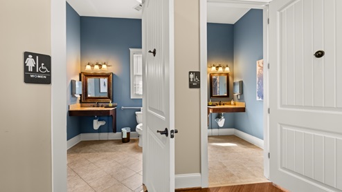 Community clubhouse hallway near bathrooms