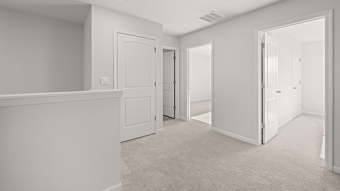 Interior upstairs loft area open to staircase