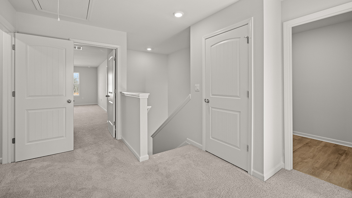 Interior upstairs loft area open to staircase