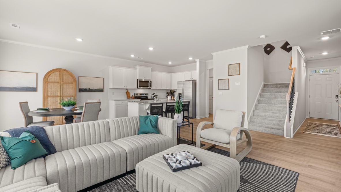 Interior living area open to kitchen and staircase