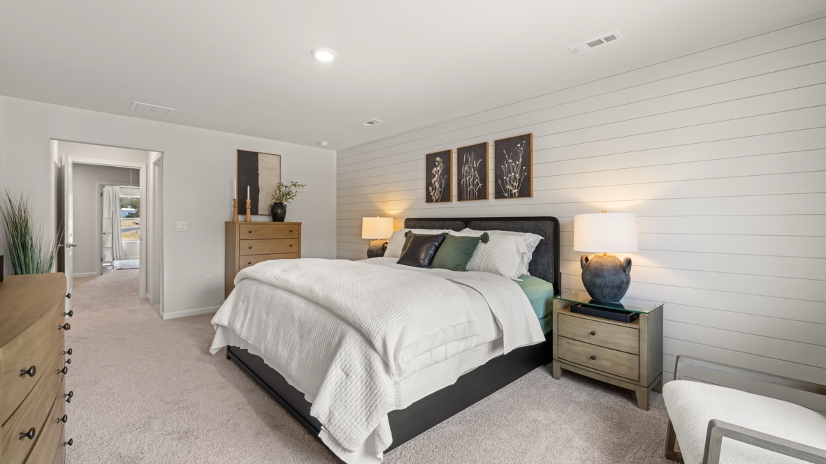 Interior primary bedroom with large window