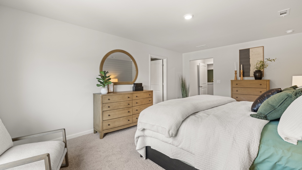 Interior primary bedroom with large window