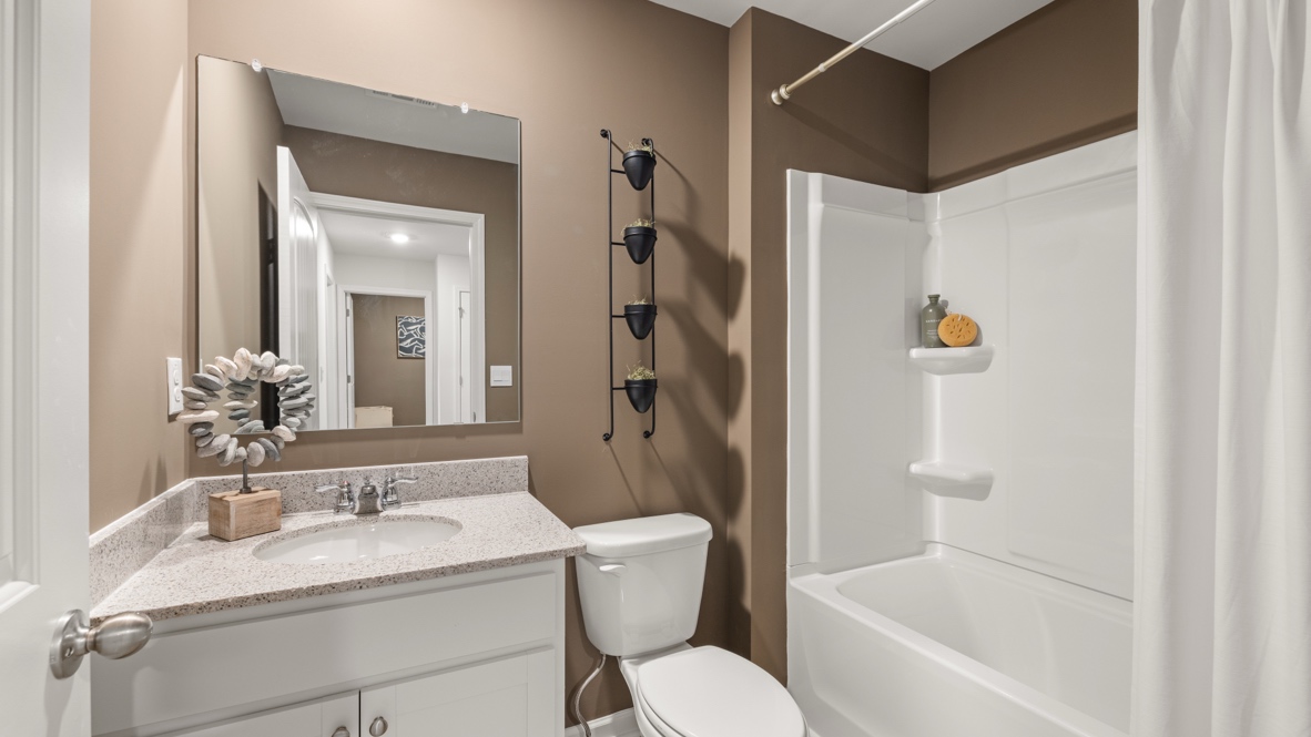 Interior bathroom with sink and full-sized shower