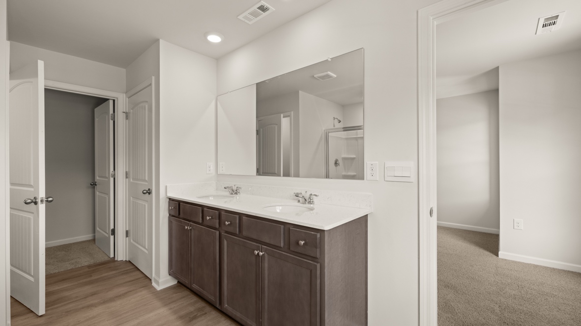 Interior primary bathroom with double sink