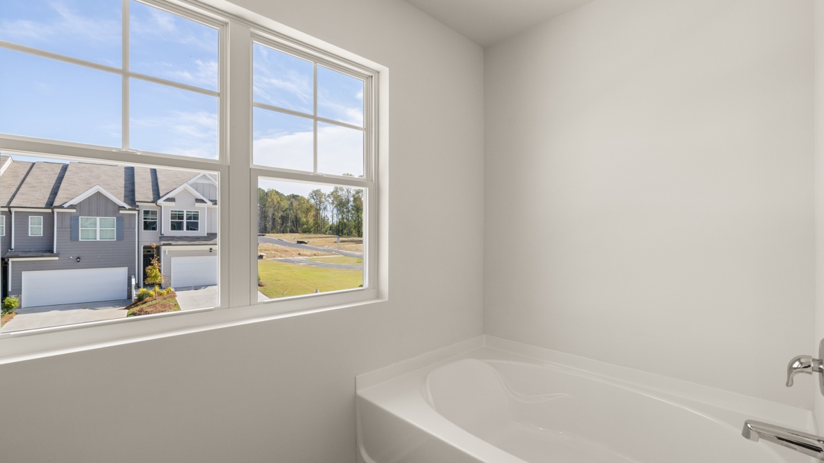 Interior primary bathroom with bath tub