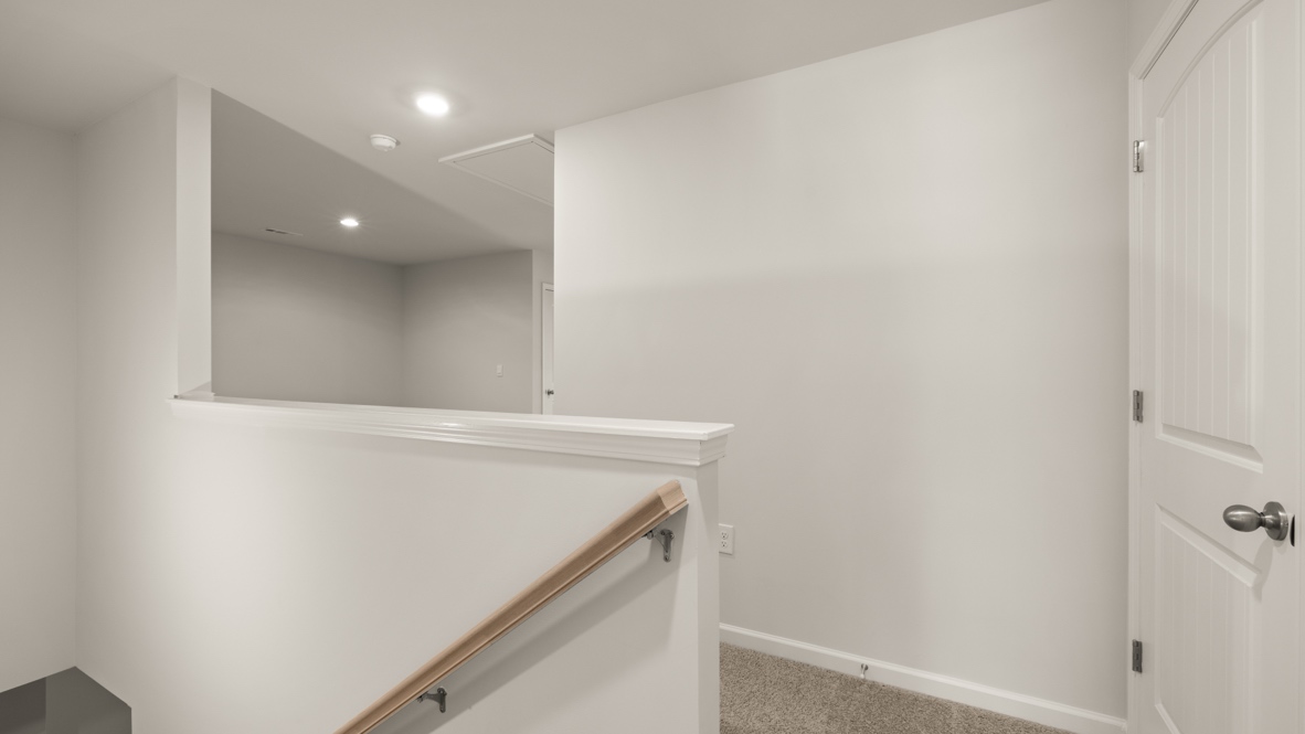 Interior upstairs loft area open to staircase