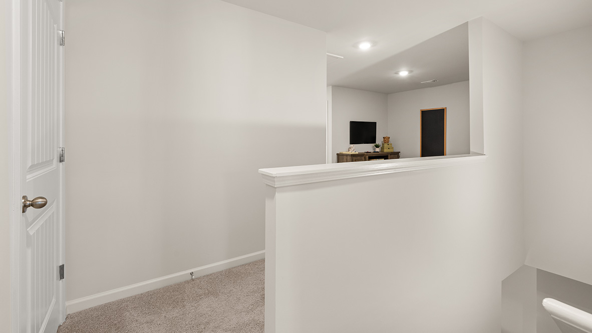 Interior upstairs loft area open to staircase