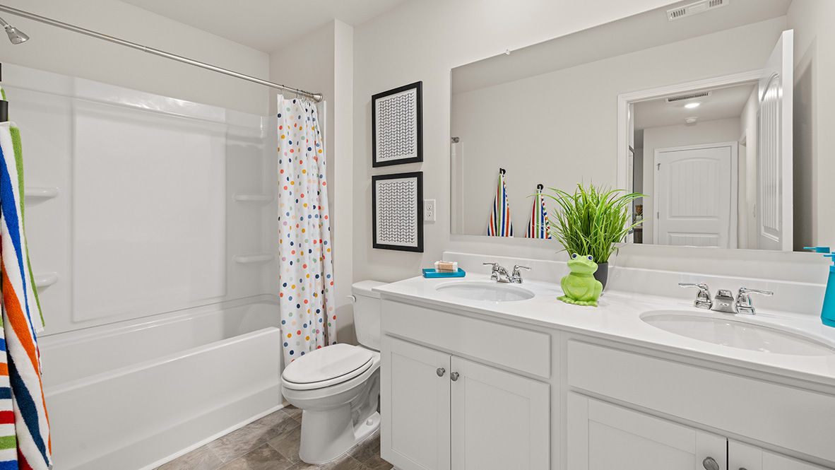 Interior bathroom with full-sized shower and double sink