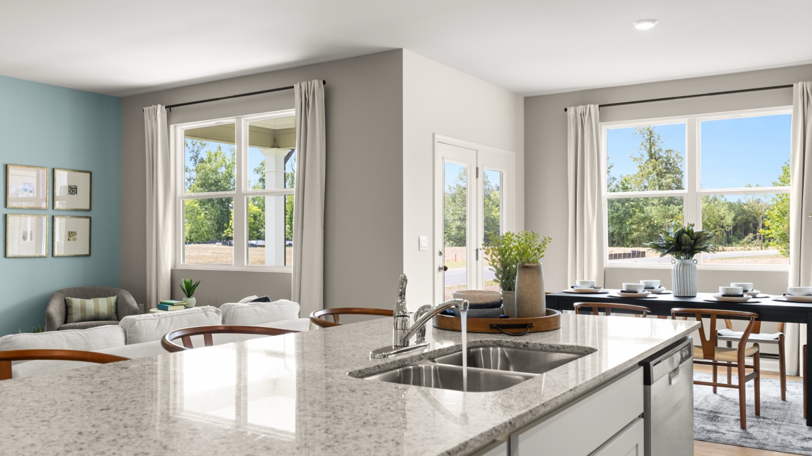 Interior kitchen with center island and white cabinets