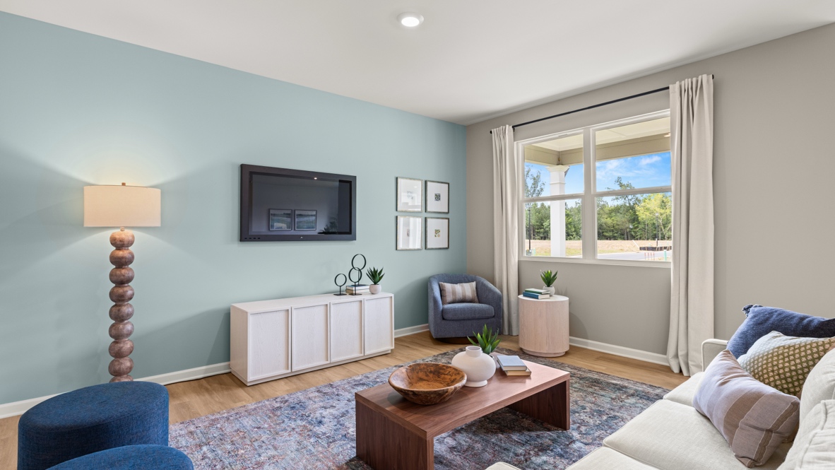 Interior living area with accent wall and large window