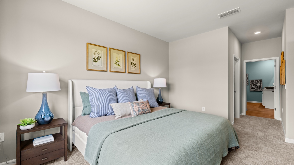 Interior primary bedroom with large window