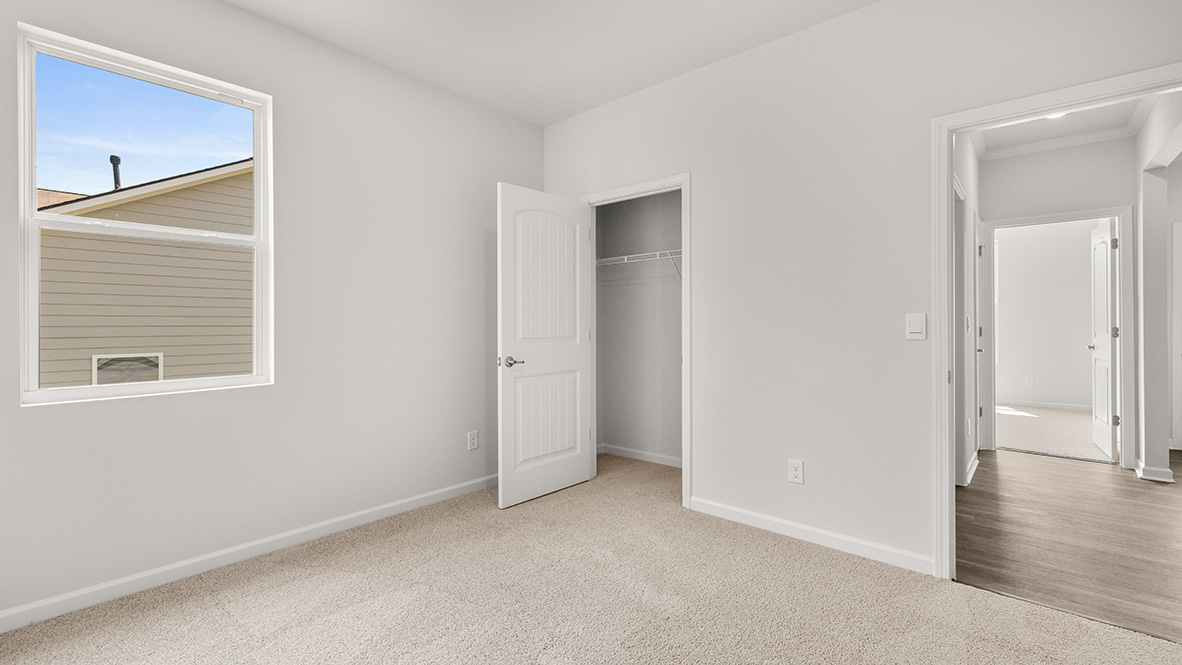 Interior bedroom with closet and window