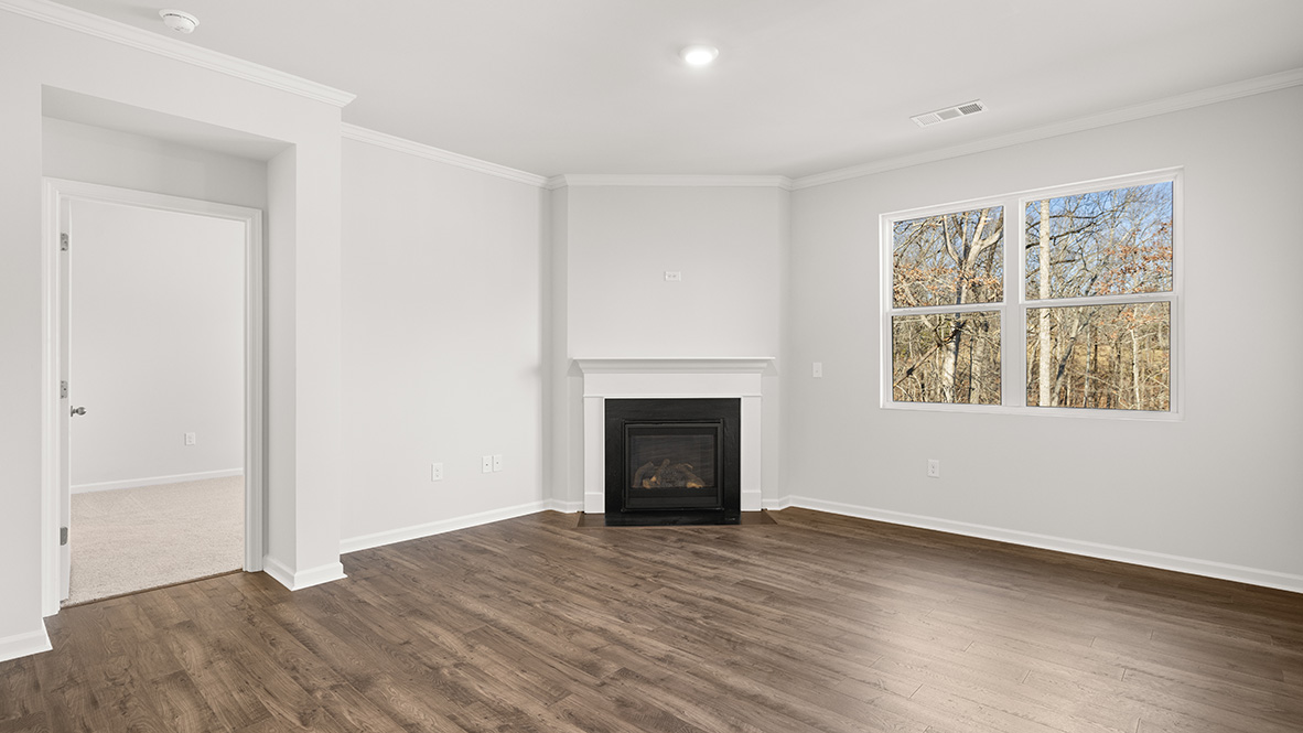 Interior living area with fire place and large window