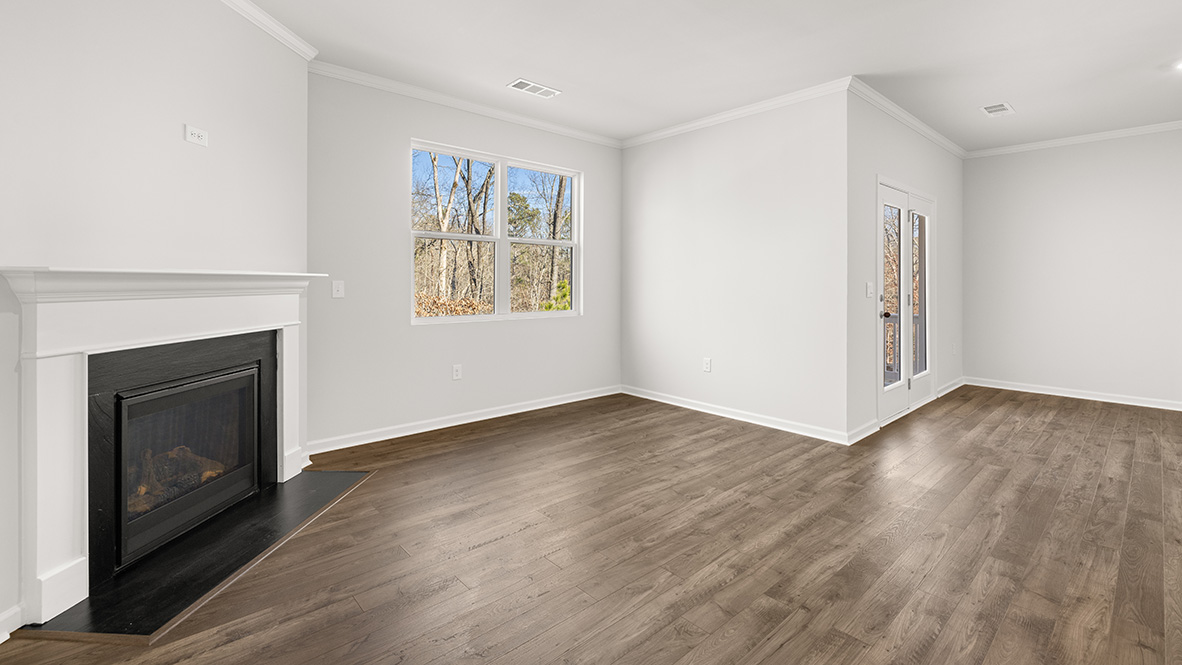 Interior living area with fire place and large window
