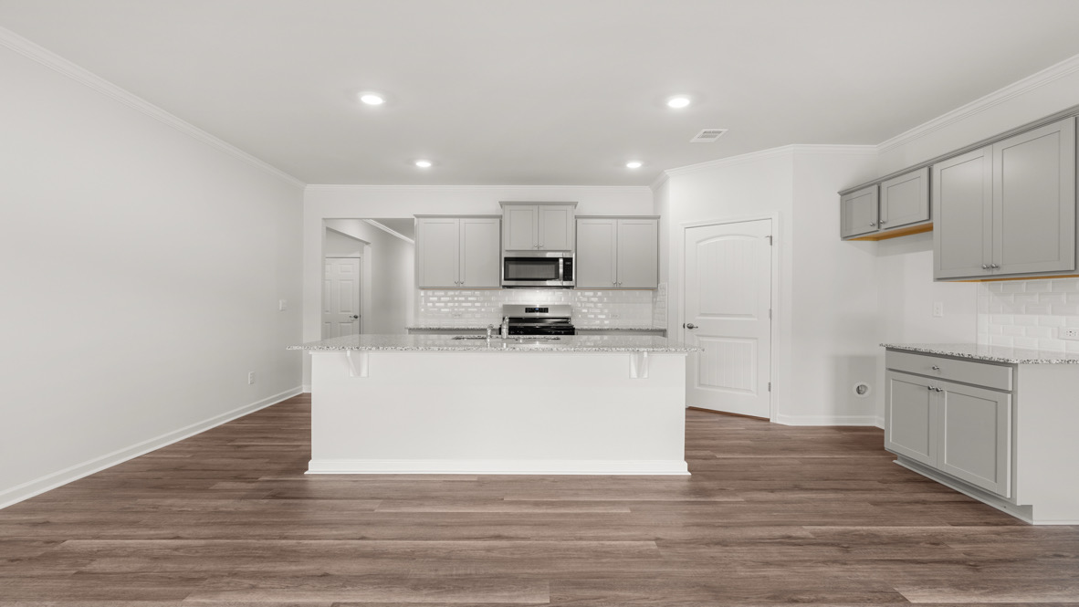 Interior kitchen with center island and light grey-cabinets