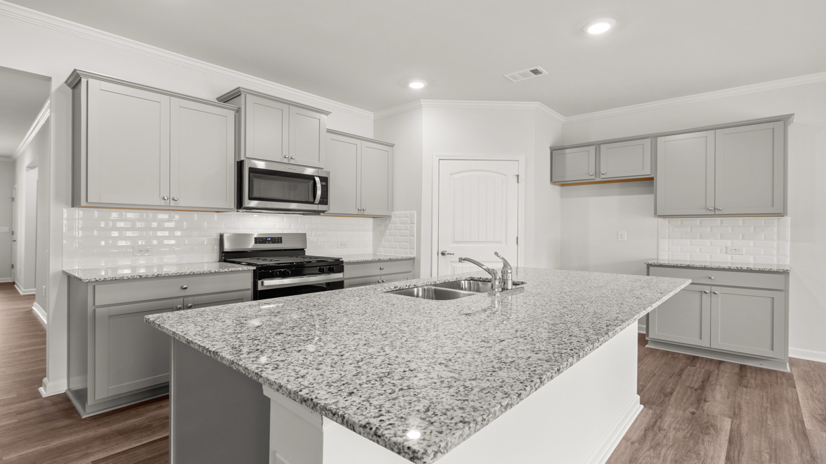 Interior kitchen with center island and light grey-cabinets