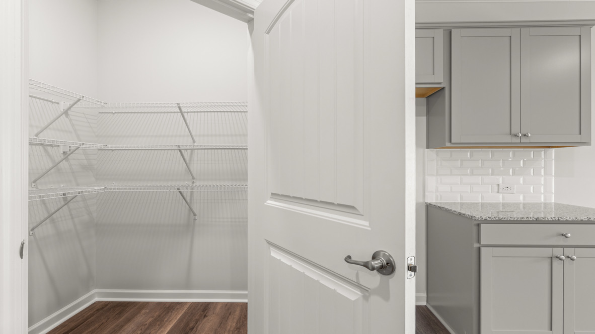 Interior pantry next to kitchen