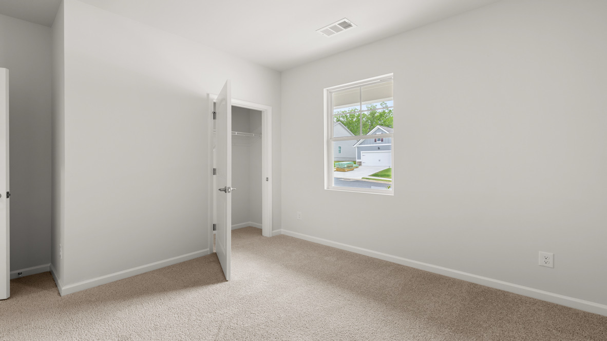 Interior bedroom with window and closet