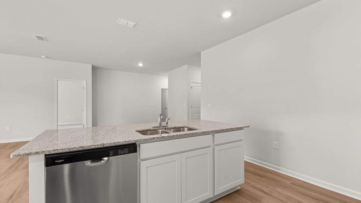 Interior kitchen with center island open to living area