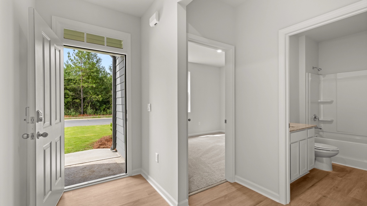 Interior entry-way near bathroom and bedroom