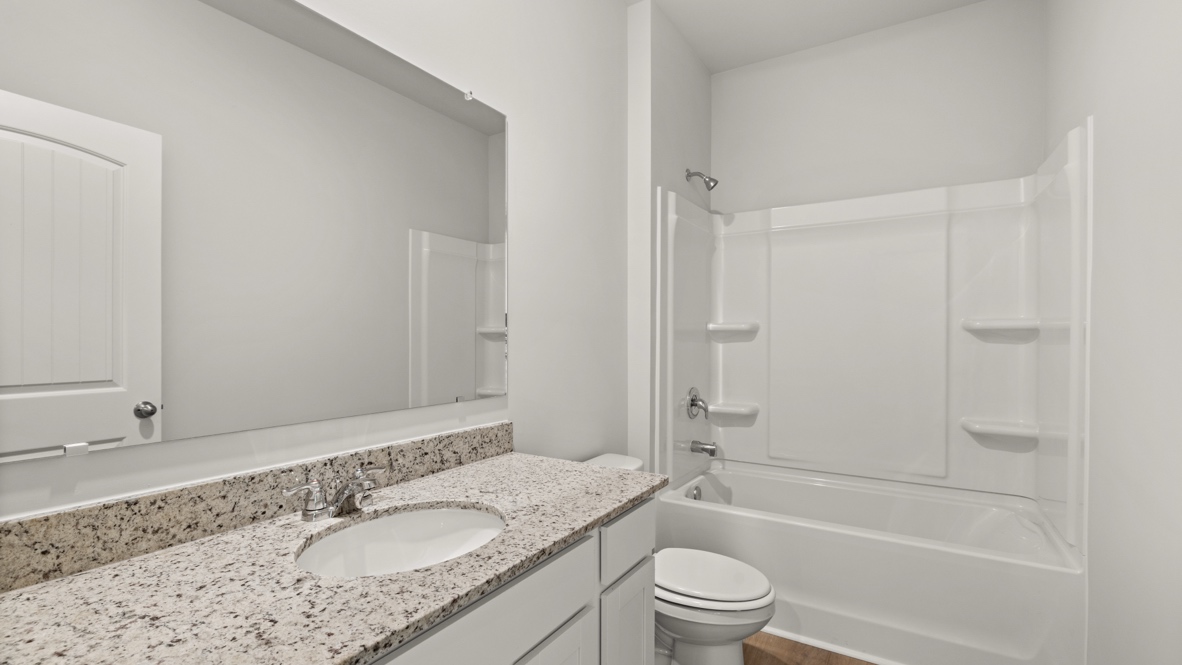 Interior bathroom with sink and full-sized shower