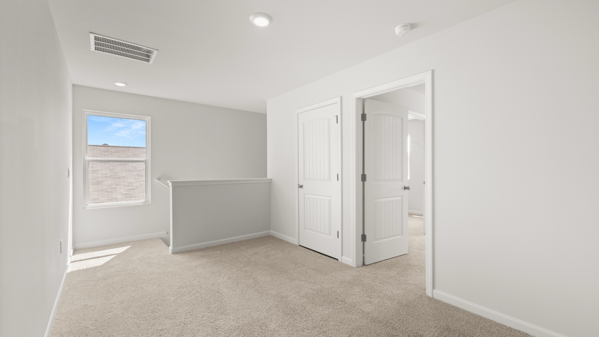 Interior upstairs loft area open to staircase