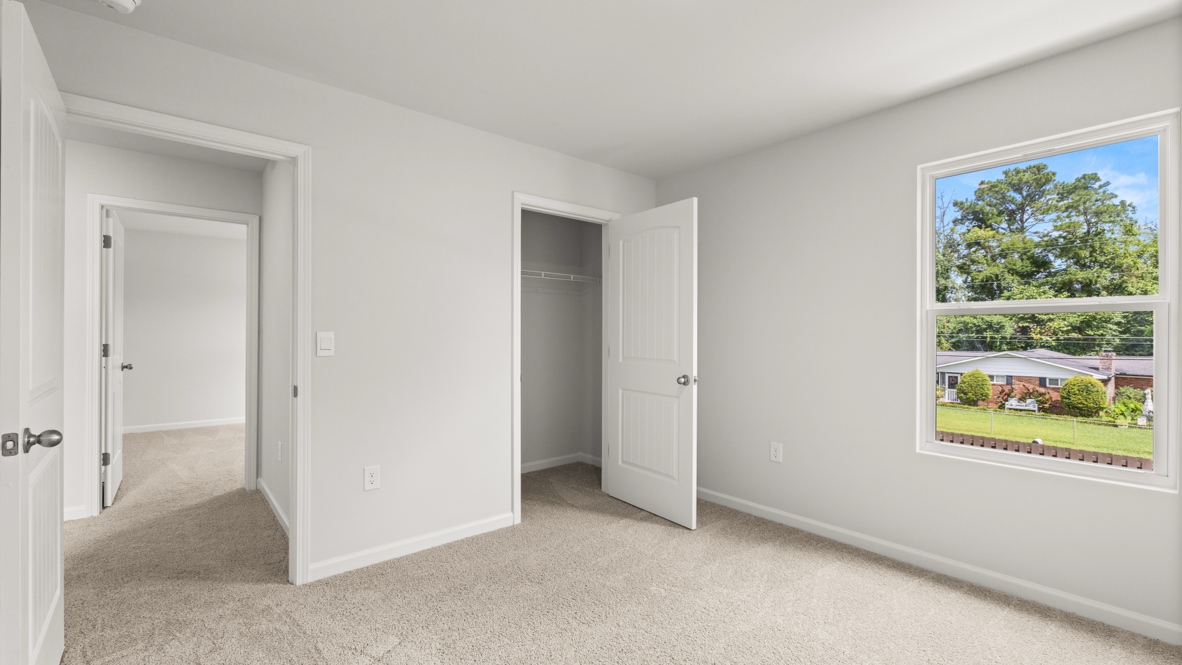 Interior bedroom with window and closet