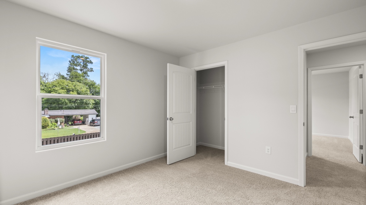 Interior bedroom with window and closet