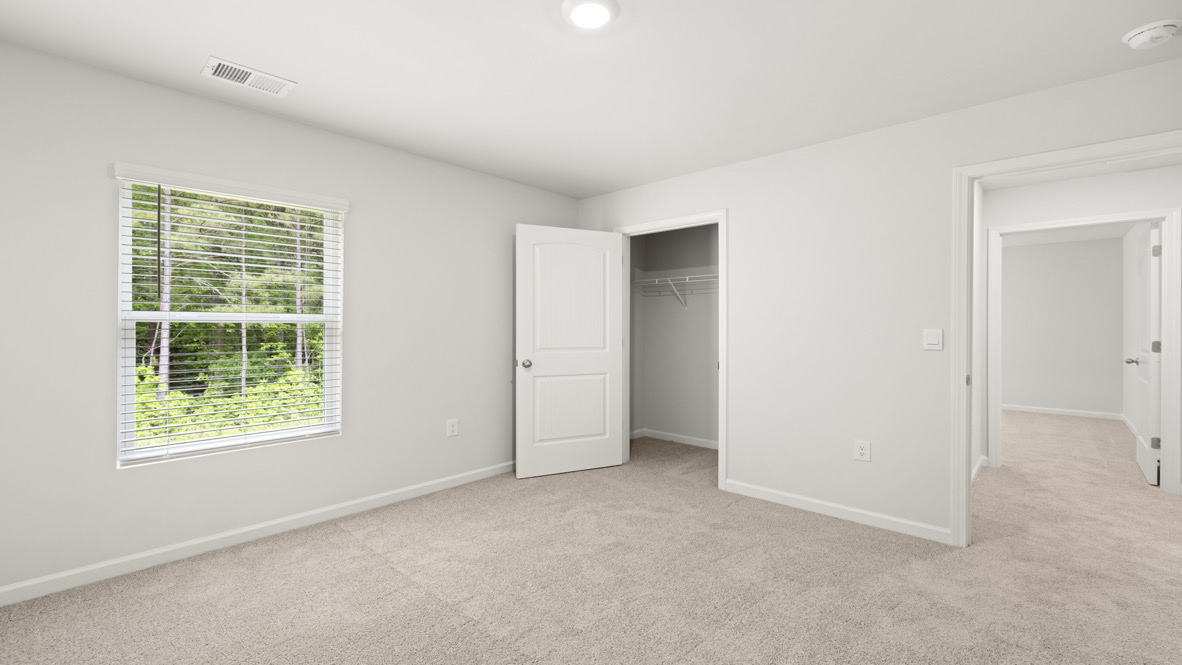 Interior bedroom with window and closet