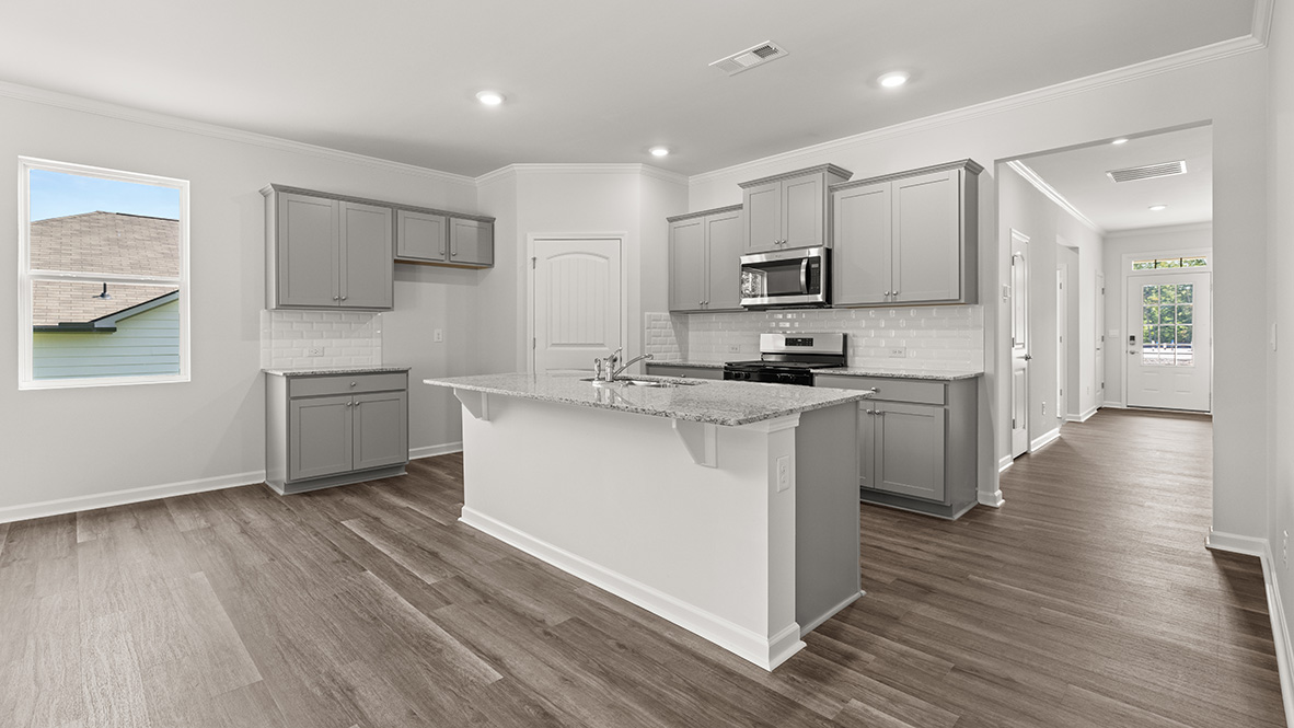 Interior kitchen with center island and light grey cabinets