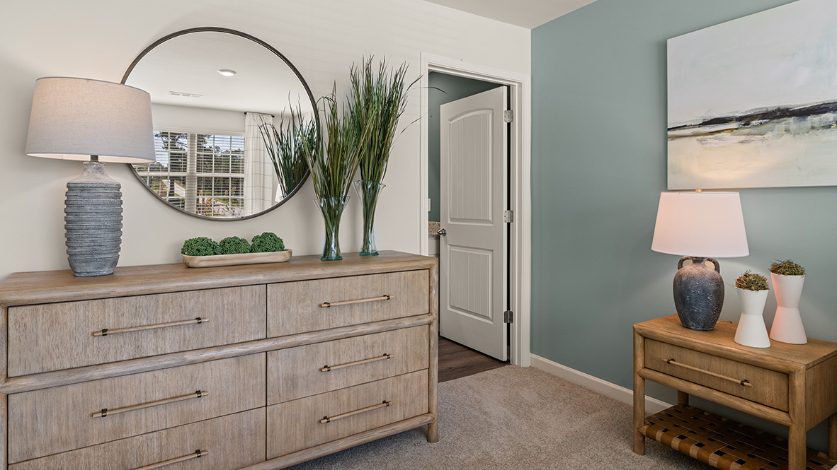 Interior primary bedroom with accent wall