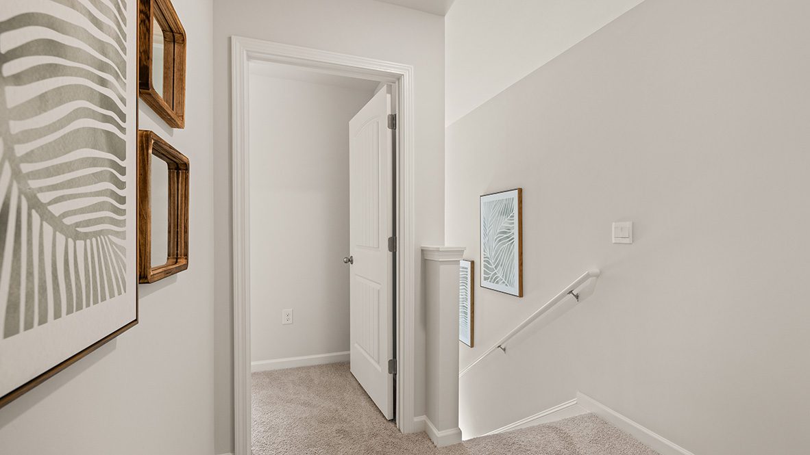 Interior upstairs hallway open to staircase