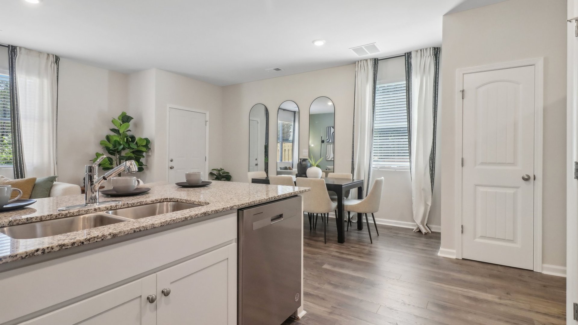 white modern kitchen with stainless steel appliances
