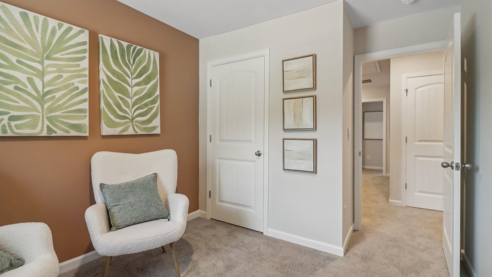 office with a dark orange accent wall