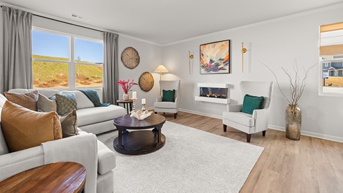 Living area with a double window and fireplace.