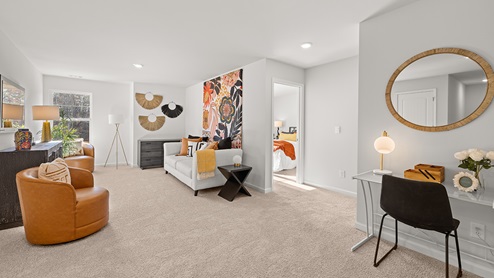 Open concept living area into the hallway and second bedroom.