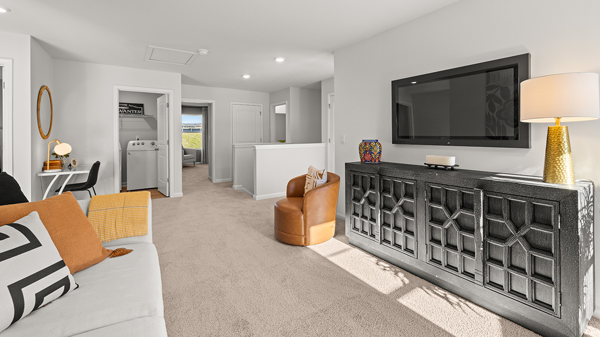 Open concept living area into the hallway and second bedroom.