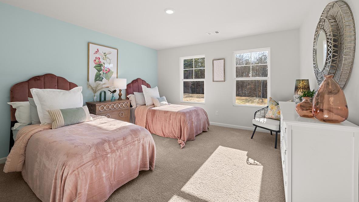 Fourth bedroom with double twin beds, double windows and white dresser.