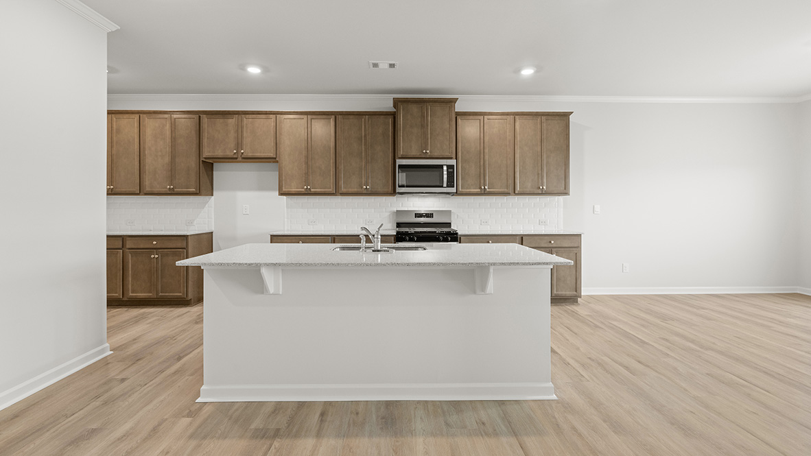 Interior kitchen with center island and wooden cabinets