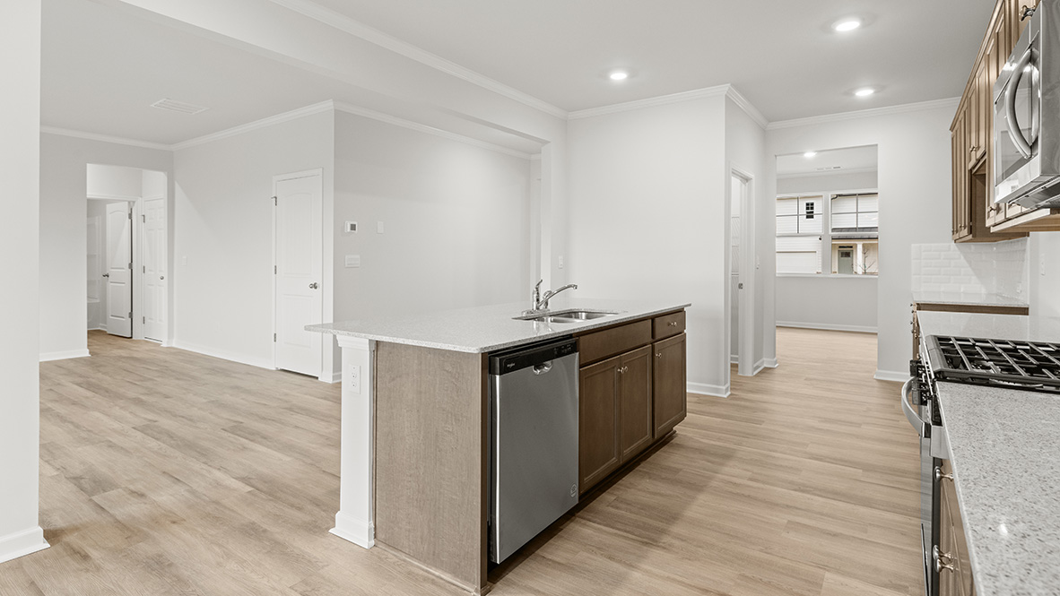 Interior kitchen with center island and wooden cabinets