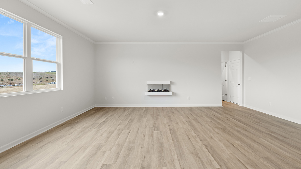 Interior living area with fire place and large windows