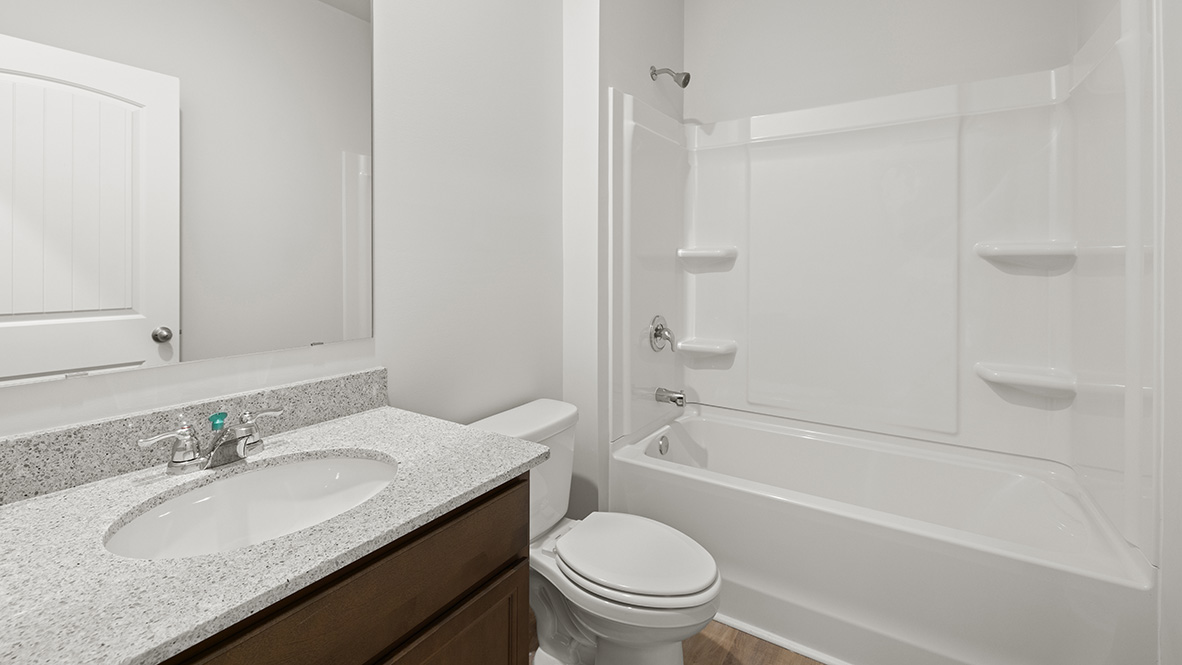 Interior bathroom with sink and full-sized shower