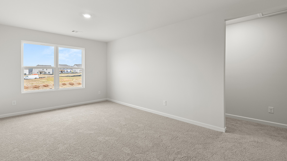 Interior upstairs loft area with large window