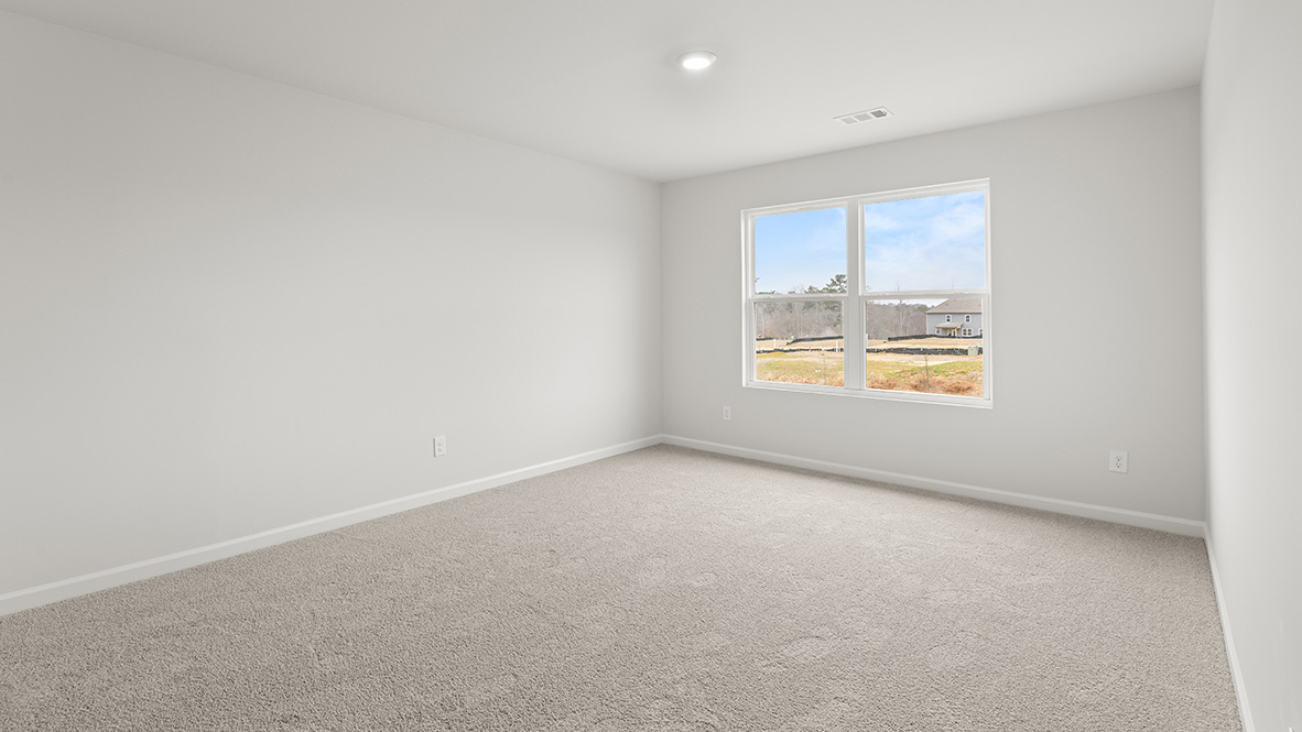 Interior upstairs loft area with large window