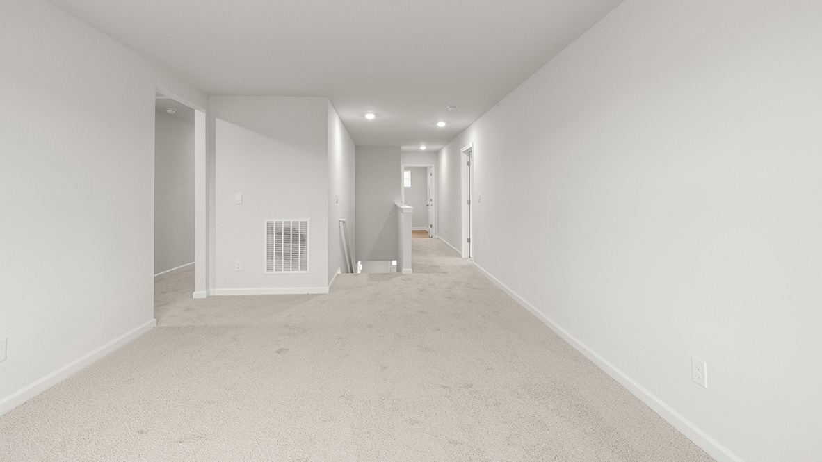 Interior upstairs loft area open to staircase