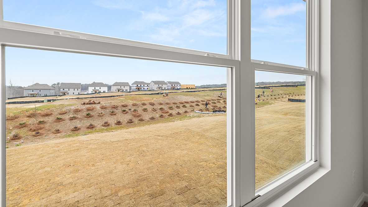 Interior upstairs loft area with large window