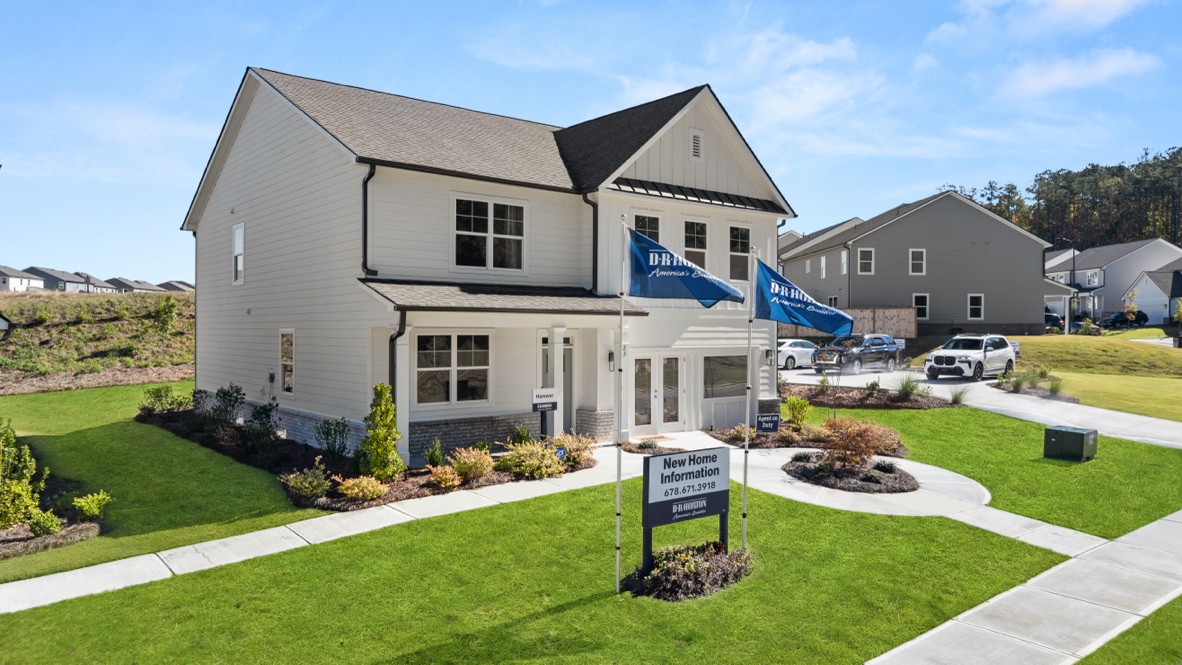 Exterior two-story home with cladding and stone detailing