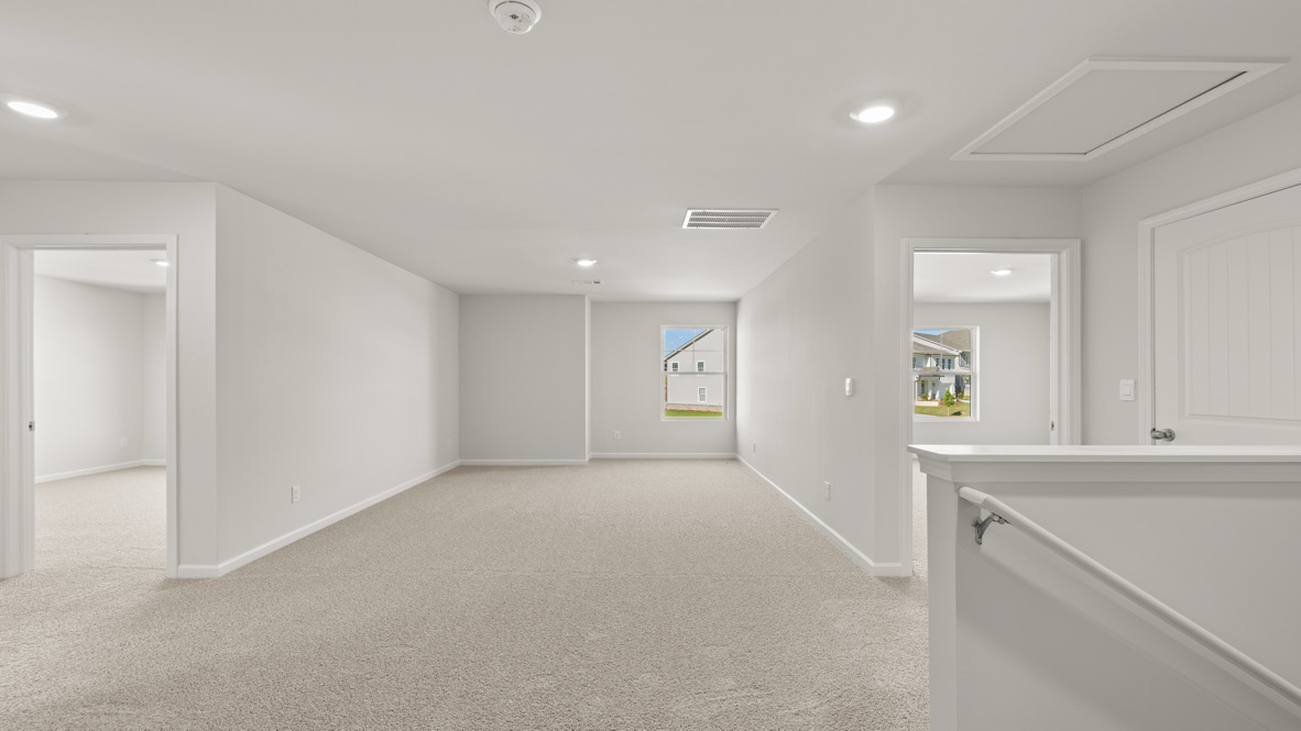 Interior upstairs loft area open to staircase